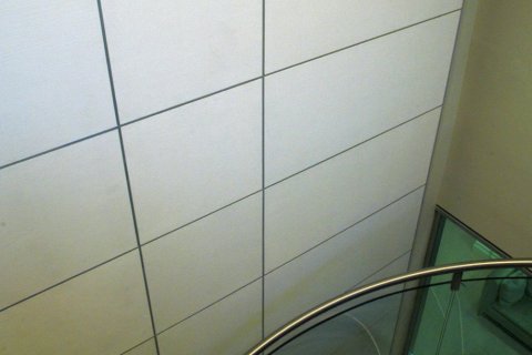 Cheyne Capital's cracked gesso wall finish against Foster's staircase